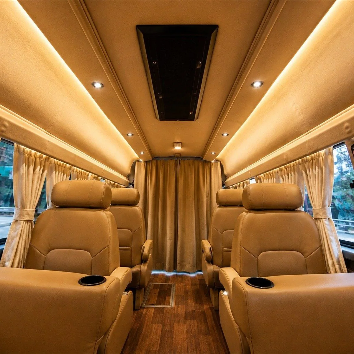 Four individual recliners inside Roving Suites, with a curtained partition to the driver cabin